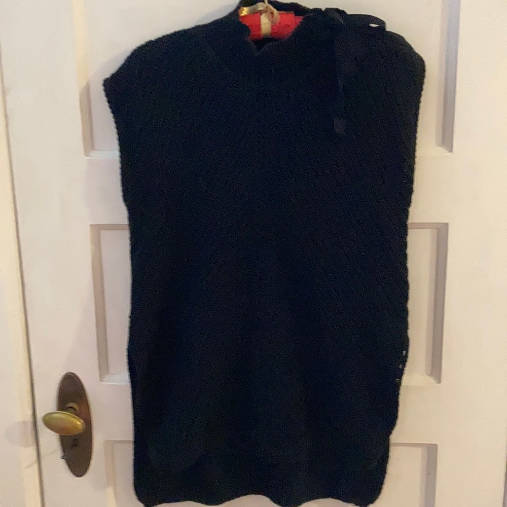 Flyaway sleeveless sweater